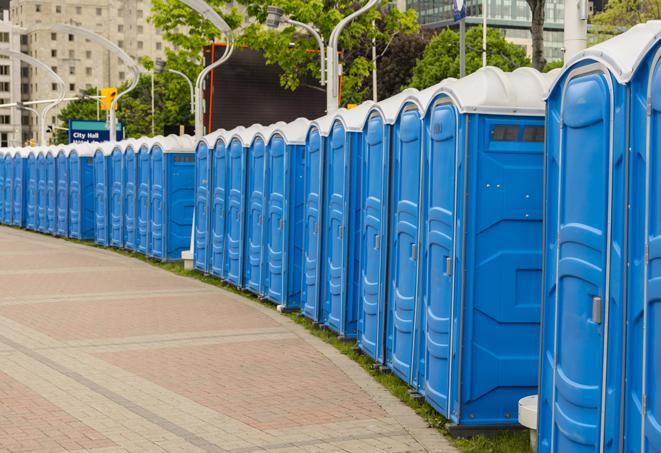 a row of portable restrooms set up for a large athletic event, allowing participants and spectators to easily take care of their needs in China Grove NC